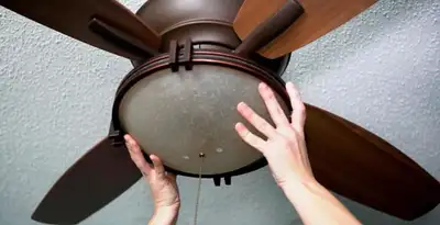 Ceiling fan repair and reinstallation on ceiling mount in Raleigh, NC