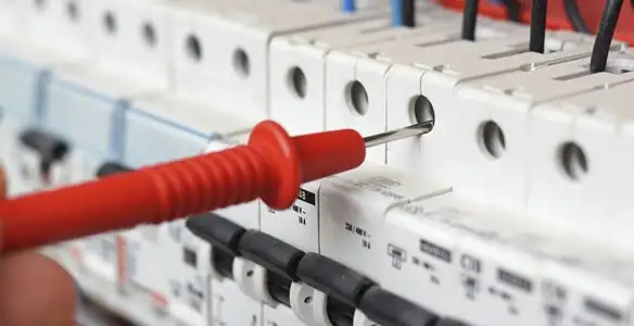Electrical contractor testing circuit breakers during electrical repair in Rolesville, NC