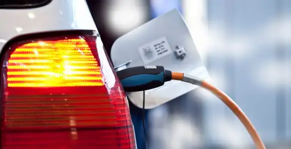 Electric car plugged into EV charger after professional installation in Raleigh, NC