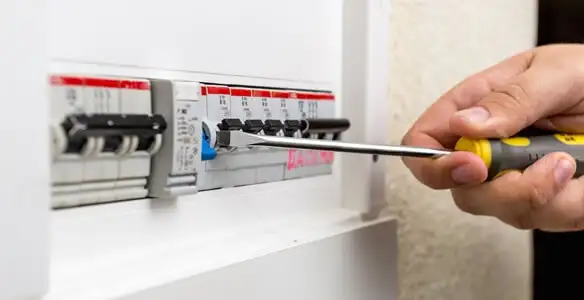 electrical panel upgrade service showing technician adjusting circuit breakers during system upgrade in Raleigh, NC