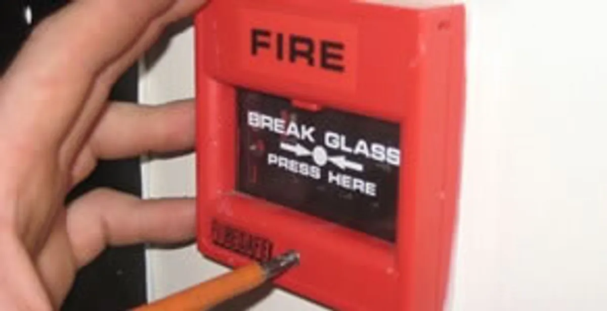 fire alarm installation service showing manual fire alarm pull station installed by licensed electricians in Raleigh, NC