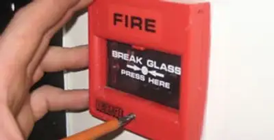 fire alarm installation service showing manual fire alarm pull station installed by licensed electricians in Raleigh, NC