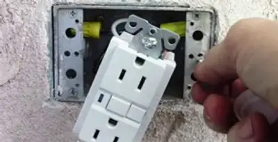 gfci circuits service showing installation of a ground fault circuit interrupter outlet by licensed electricians in Raleigh, NC