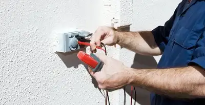 Electrician performing home electrical outlet and wiring inspection in Raleigh, NC