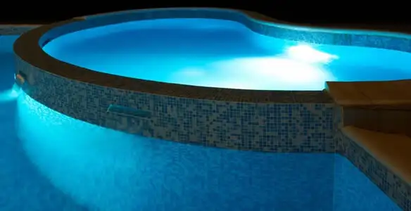 pool light installation and repair services highlighting illuminated pool interior lighting in Raleigh, NC