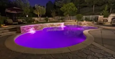 pool light installation and repair services illuminating a residential swimming pool in Raleigh, NC